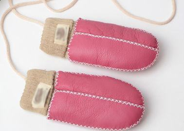 중국 가장 온난한 밝은 분홍색 팔목을 가진 손에 의하여 꿰매어지는 아기 양가죽 Mittens 협력 업체